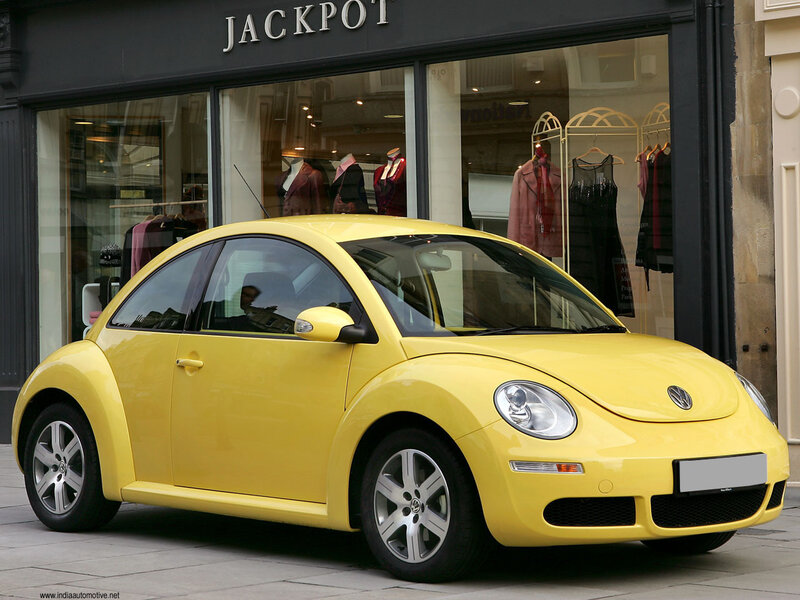 Yellow Volkswagen Beetle parked
