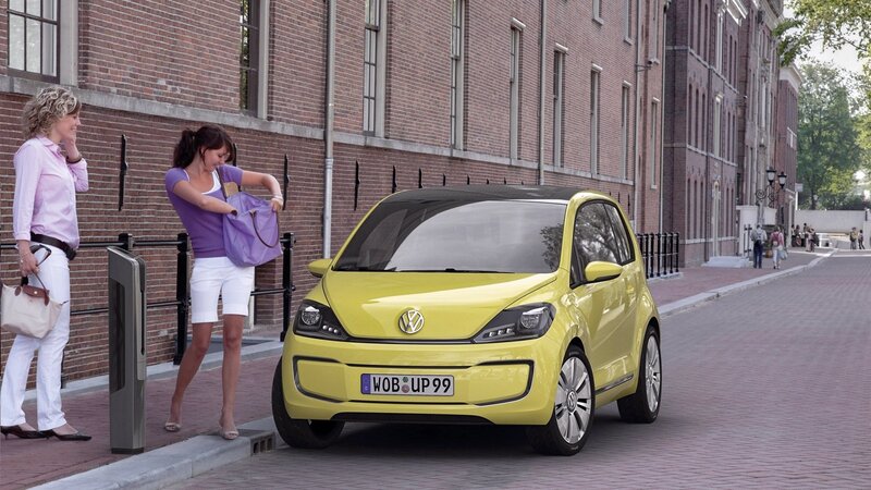 Yellow Volkswagen car on city street