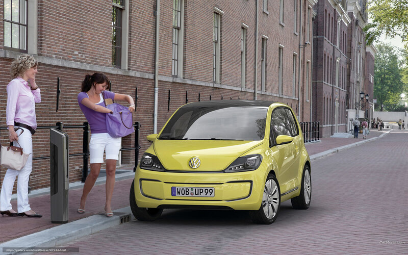 Yellow Volkswagen car on street