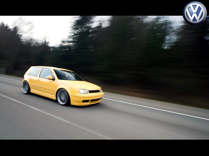 yellow volkswagen on road