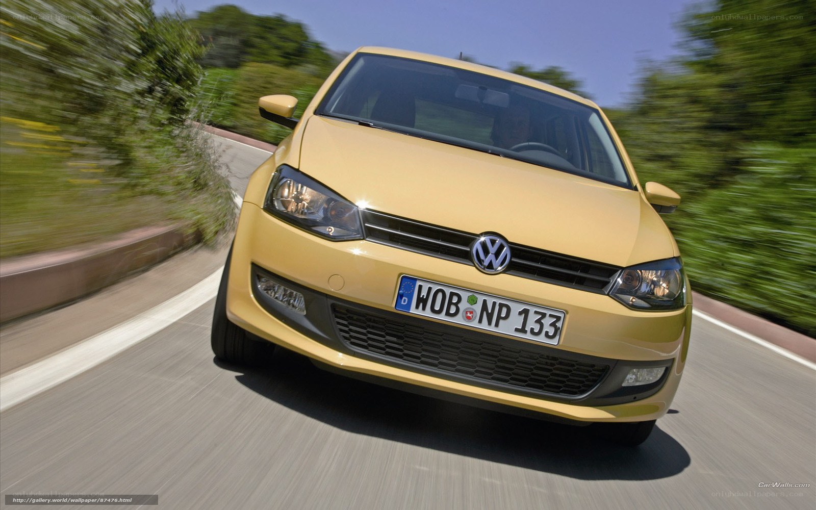 yellow volkswagen on road