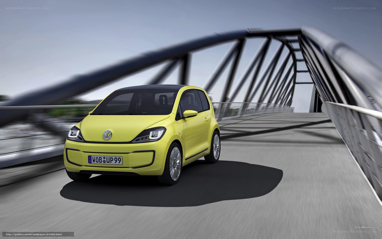 yellow volkswagen up! on a bridge