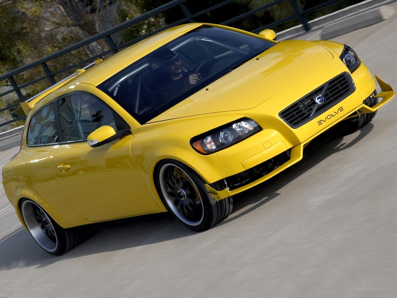 yellow volvo c30 evolve in motion