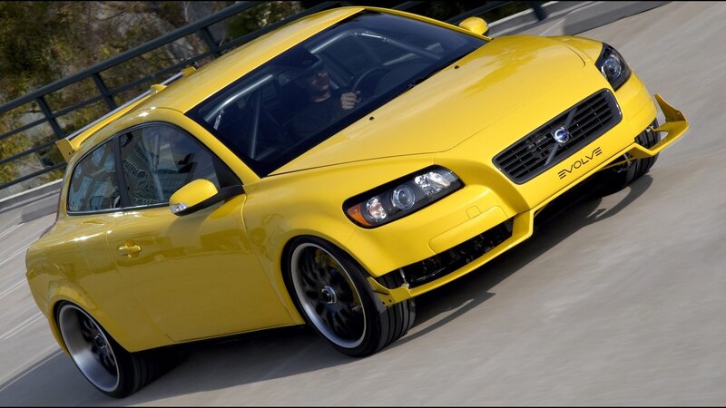 Yellow Volvo C30 on a road