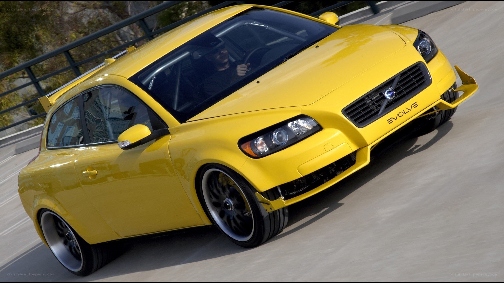 Yellow Volvo C30 on a road
