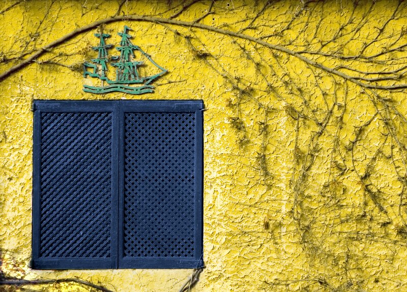 yellow wall with ship emblem