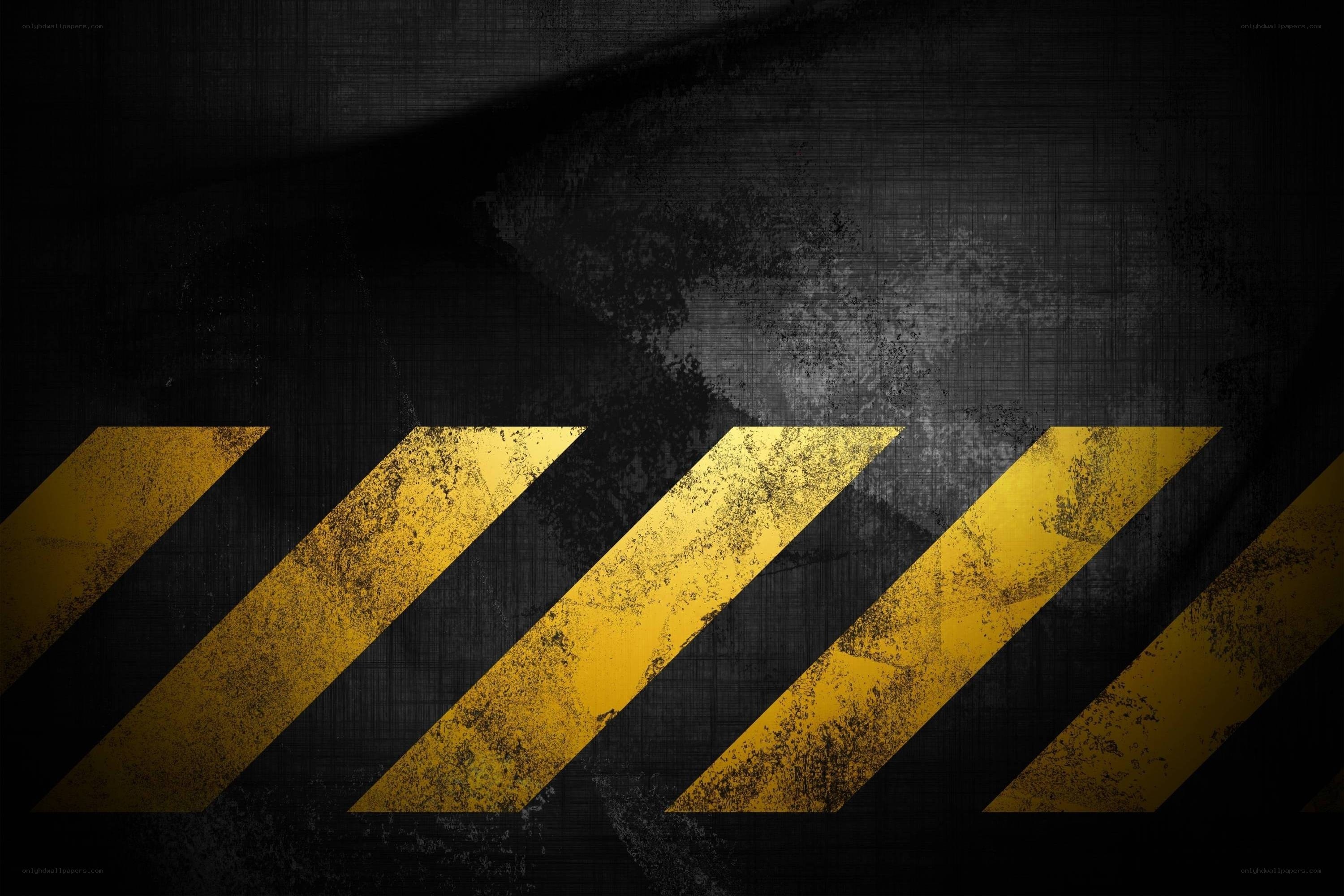 yellow warning stripes on dark background