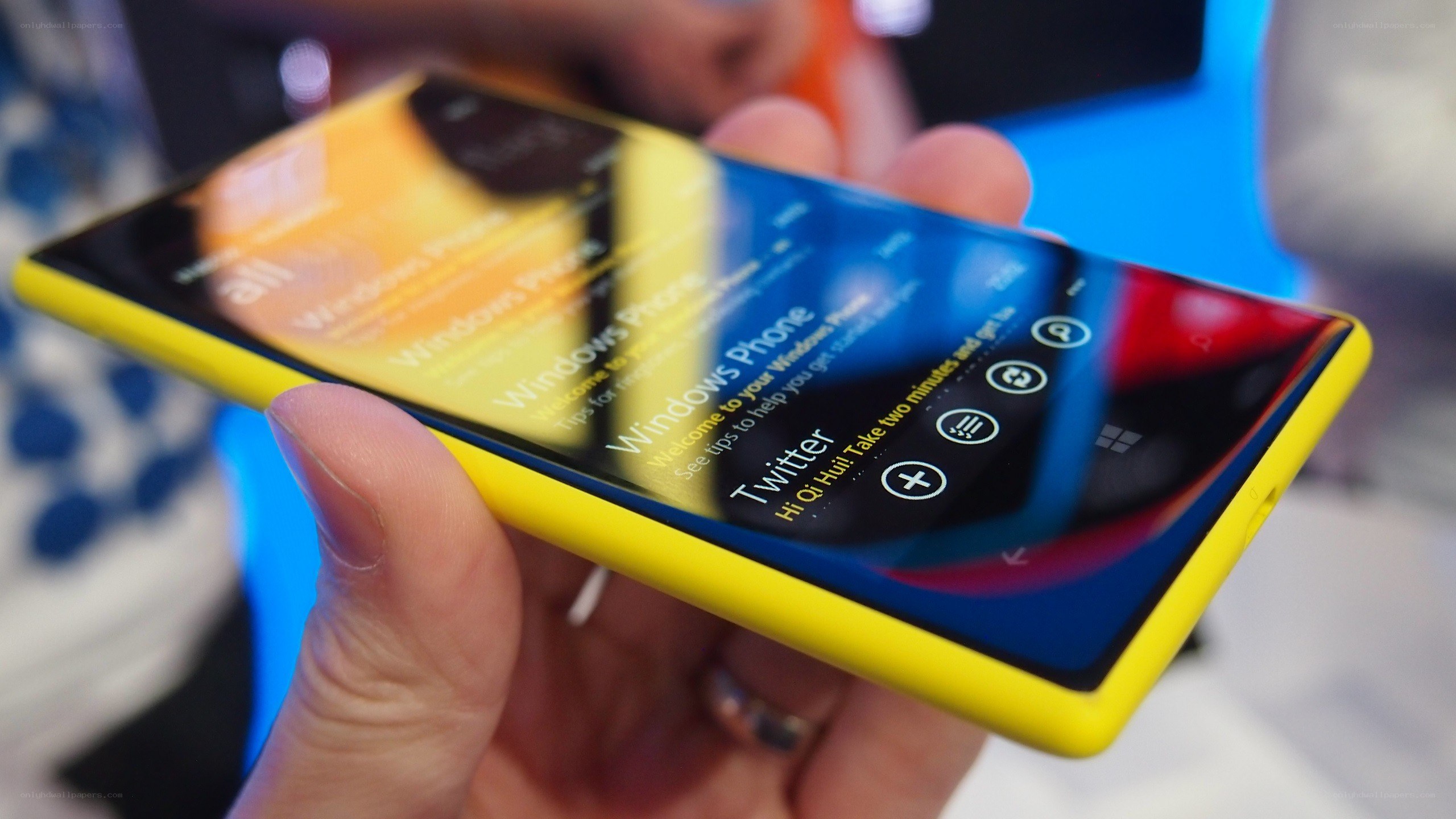 Yellow Windows Phone in hand