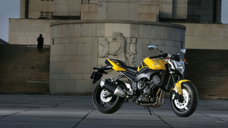 Yellow Yamaha motorcycle in city