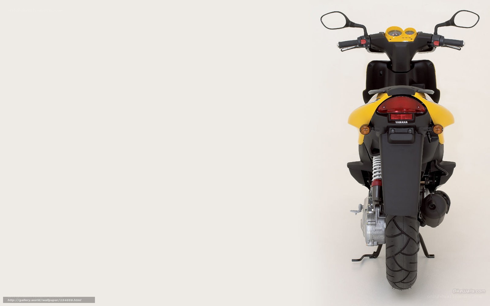Yellow Yamaha scooter rear view
