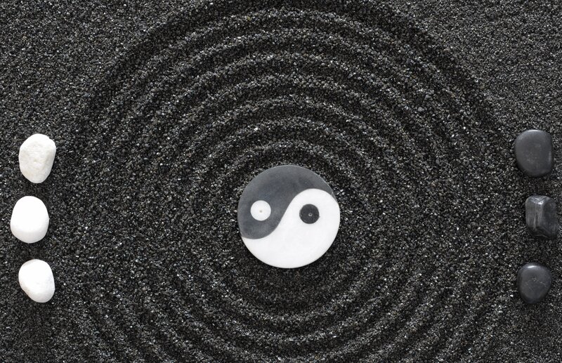 Yin-yang symbol in sand