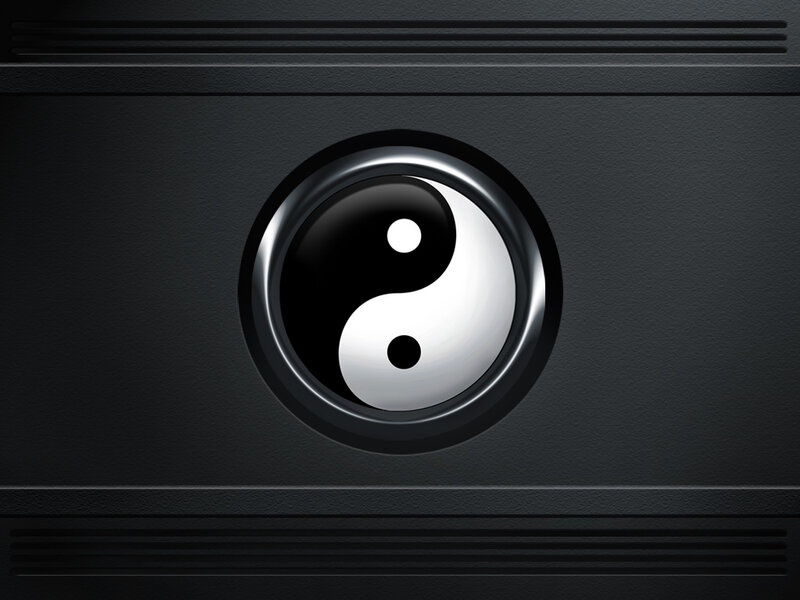 yin-yang symbol on black surface