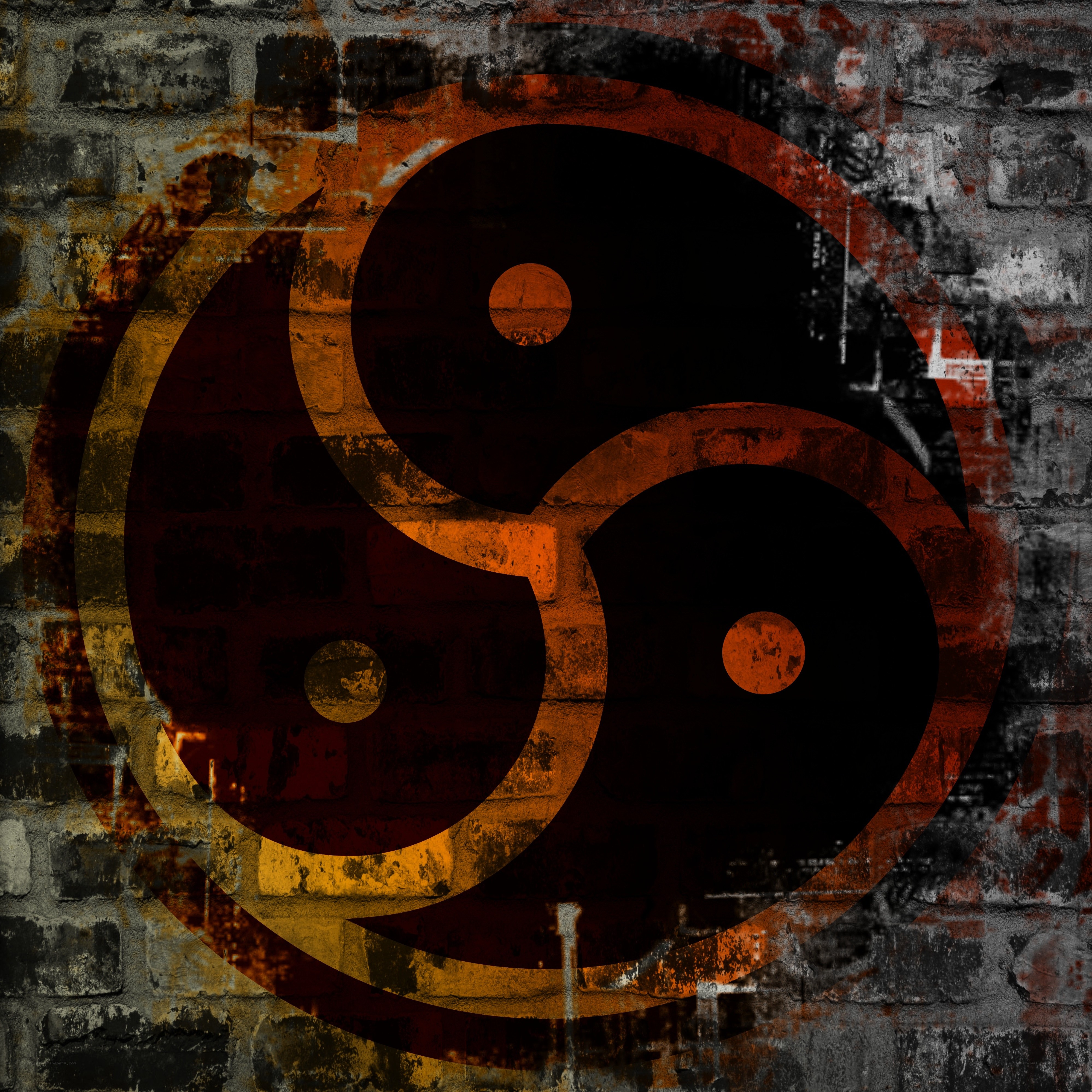 yin-yang symbol on brick wall