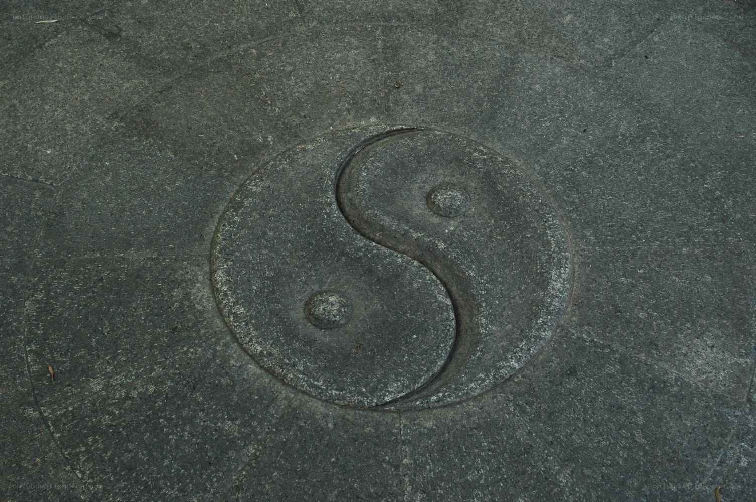 Yin-yang symbol on stone