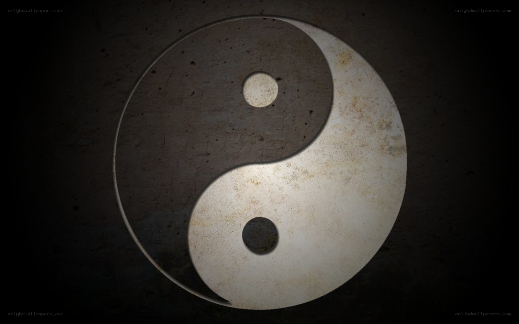 Yin-yang symbol on stone