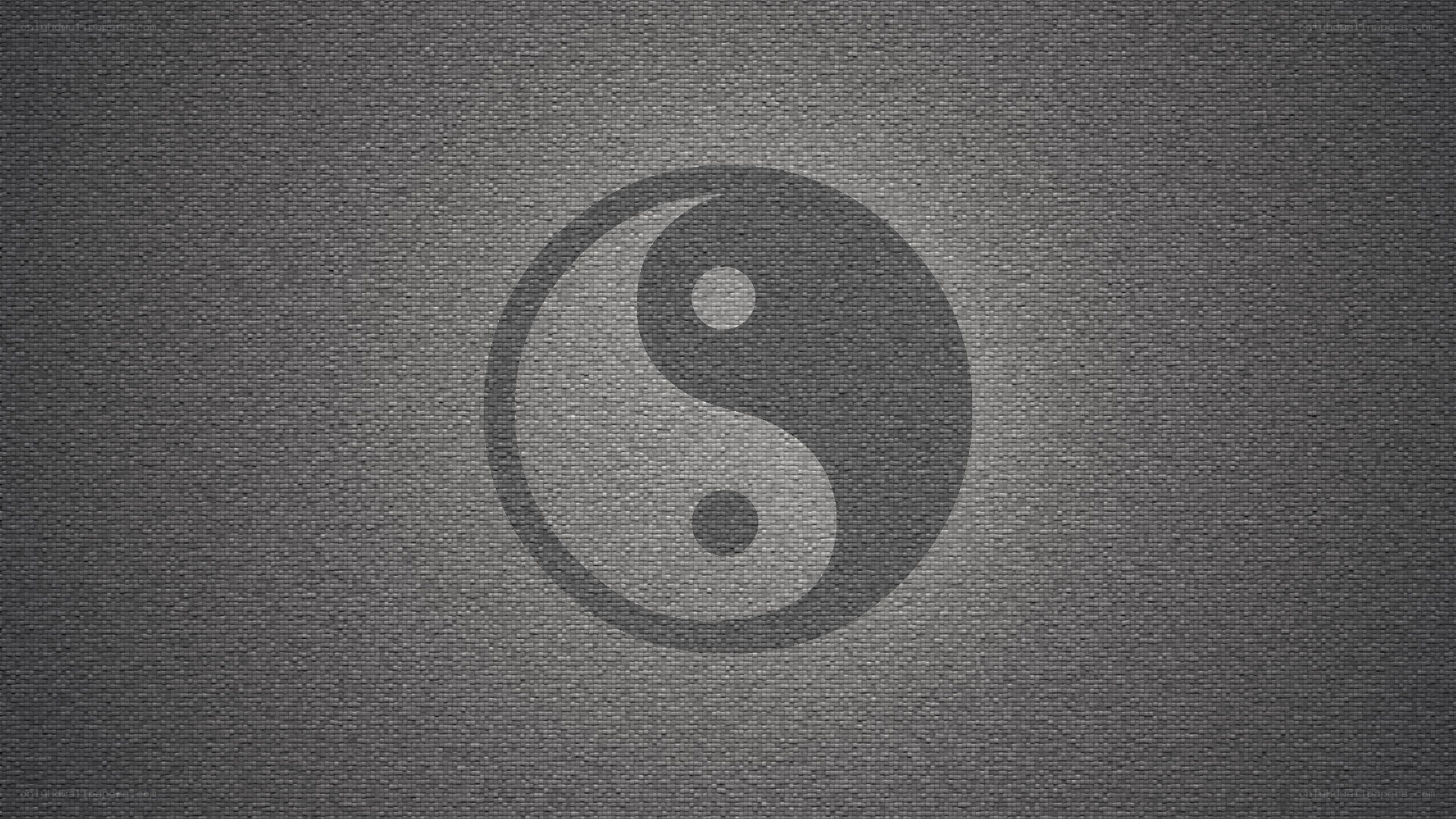 Yin-yang symbol on textured background