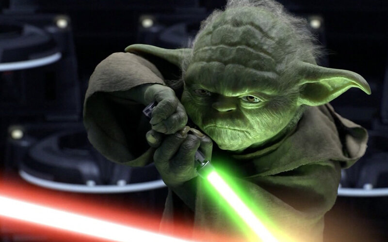 Yoda with green lightsaber