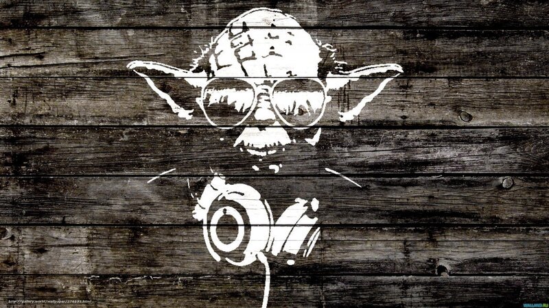 Yoda with headphones on wood