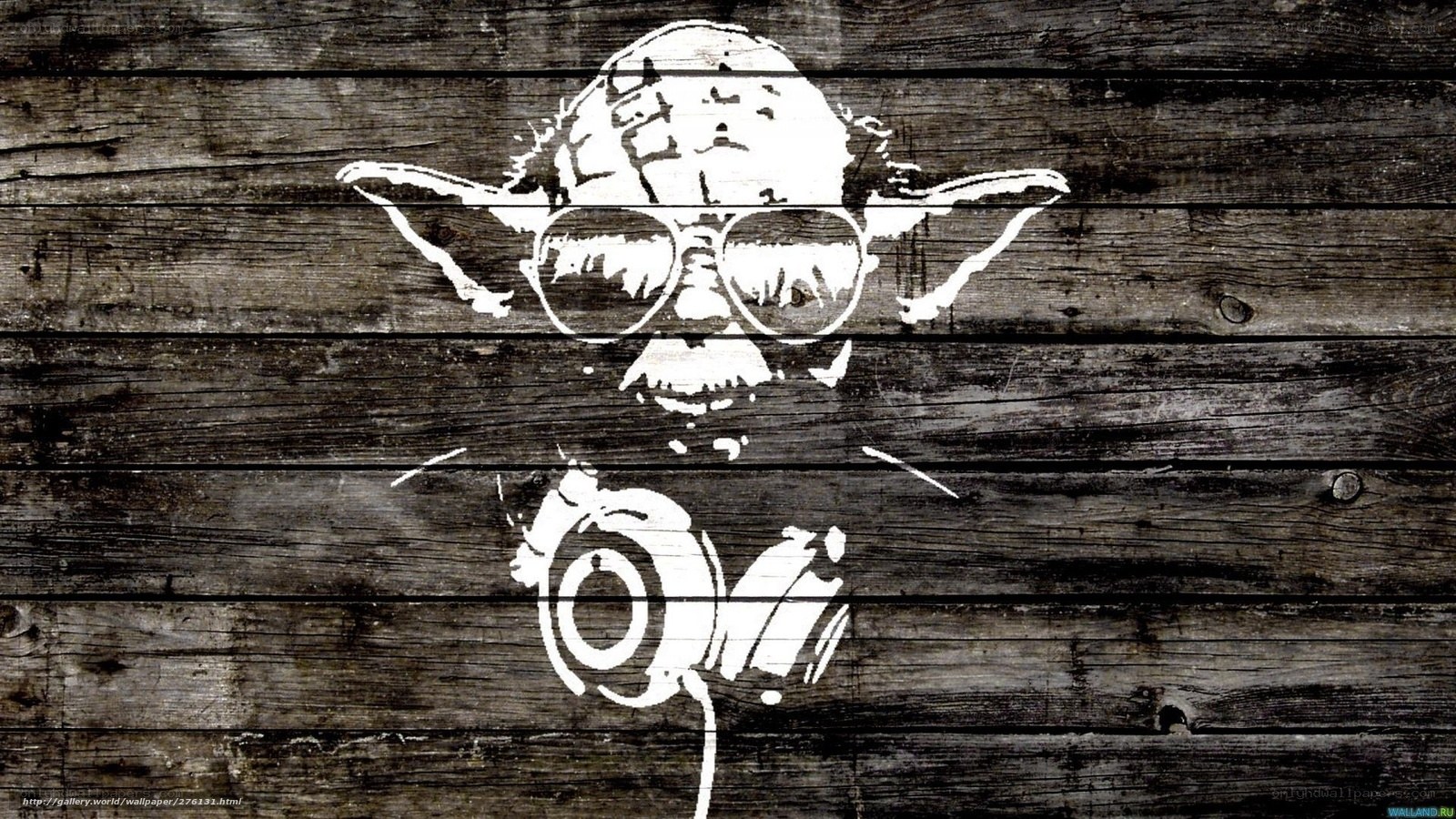 Yoda with headphones on wood