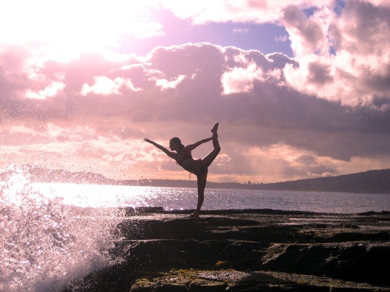 Yoga at sunset by the sea