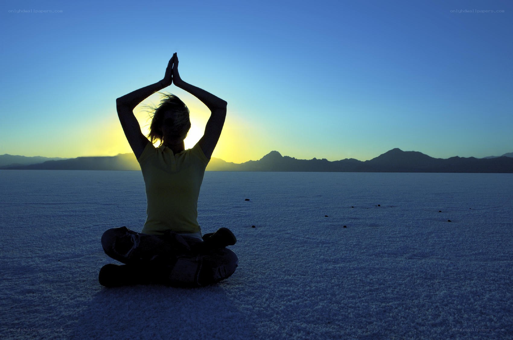 Yoga at sunset on a salt flat