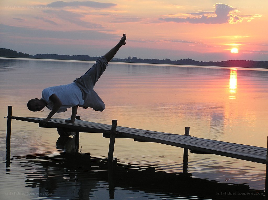 Yoga on a dock at sunset