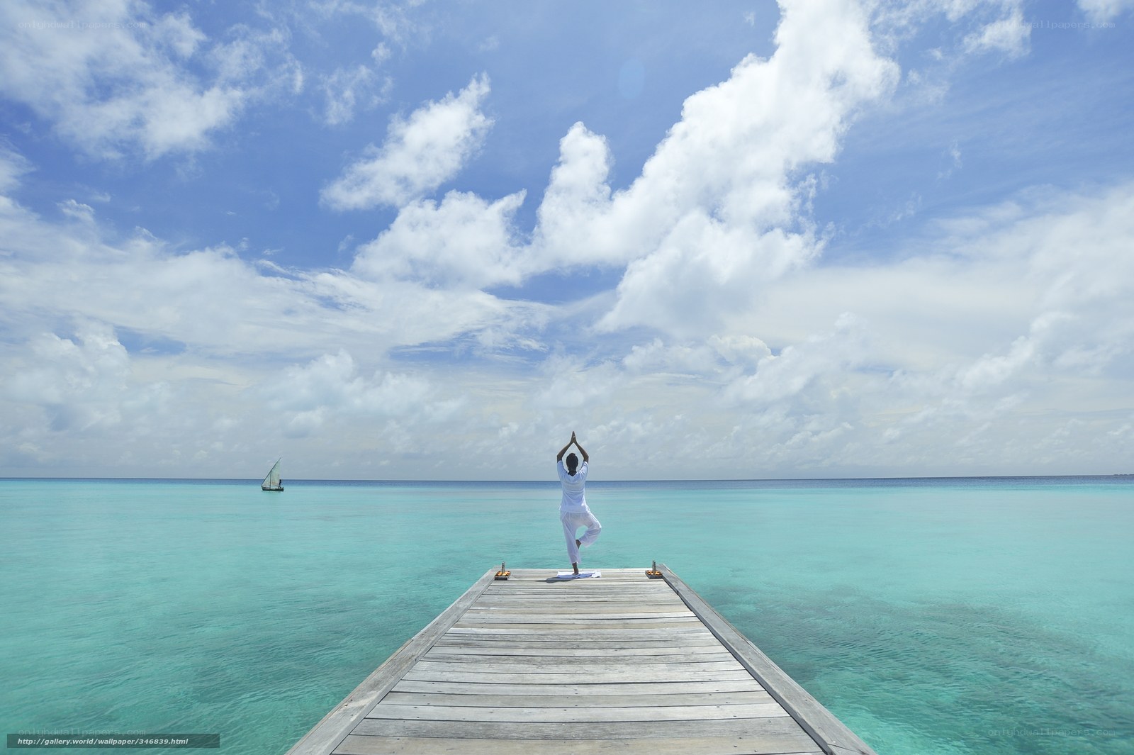 Yoga on a pier at the beach