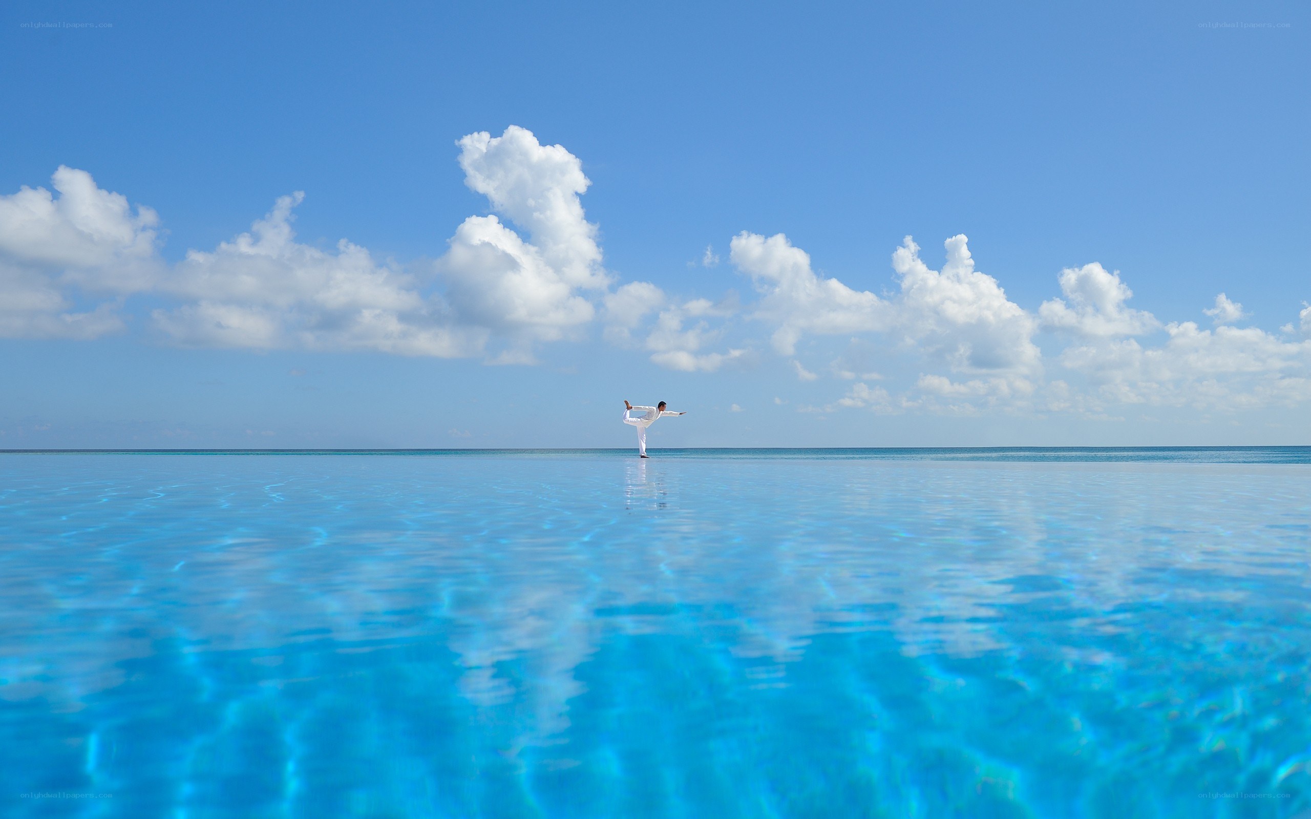 Yoga on infinity pool