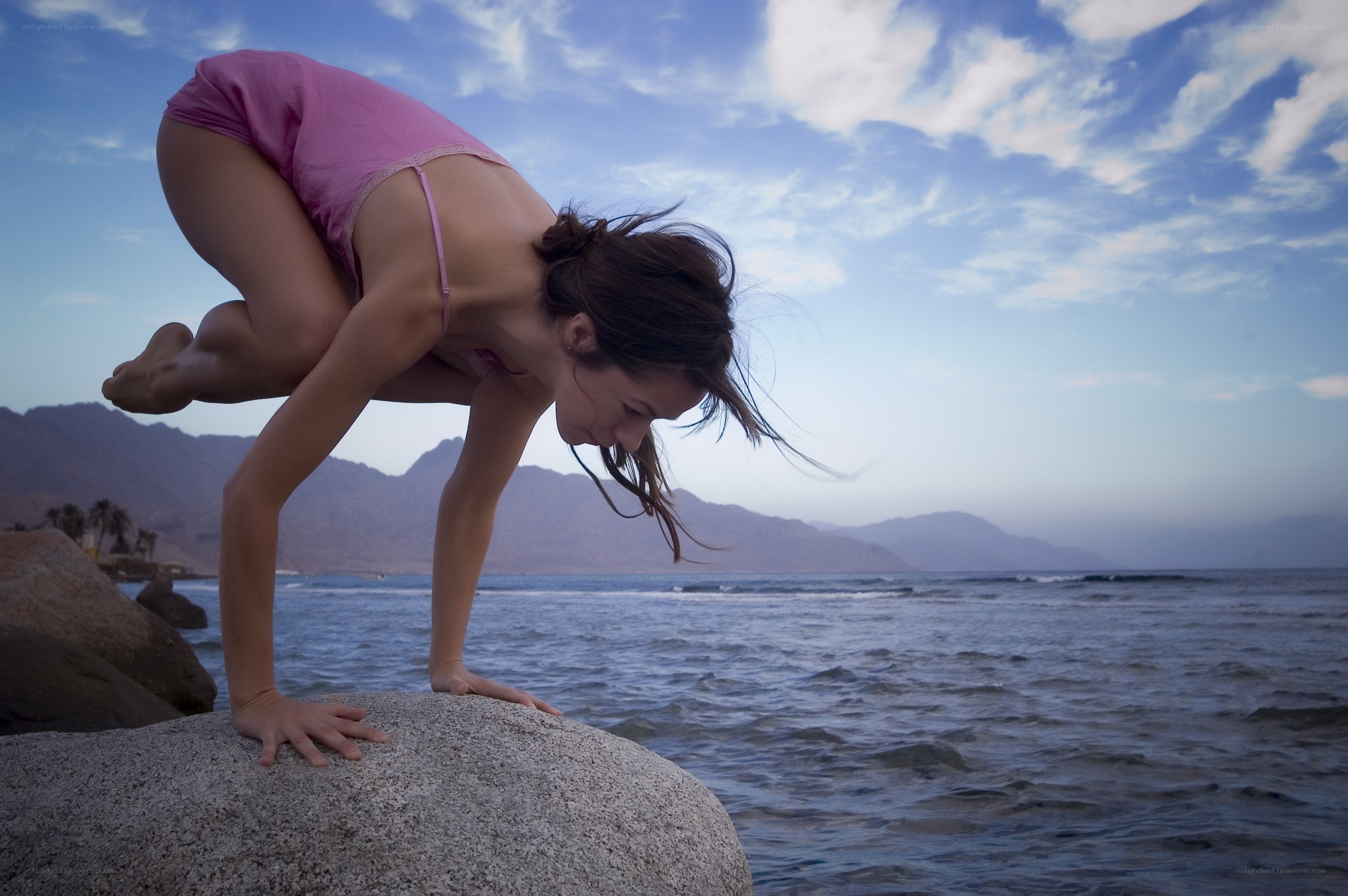 Yoga on the beach at sunset