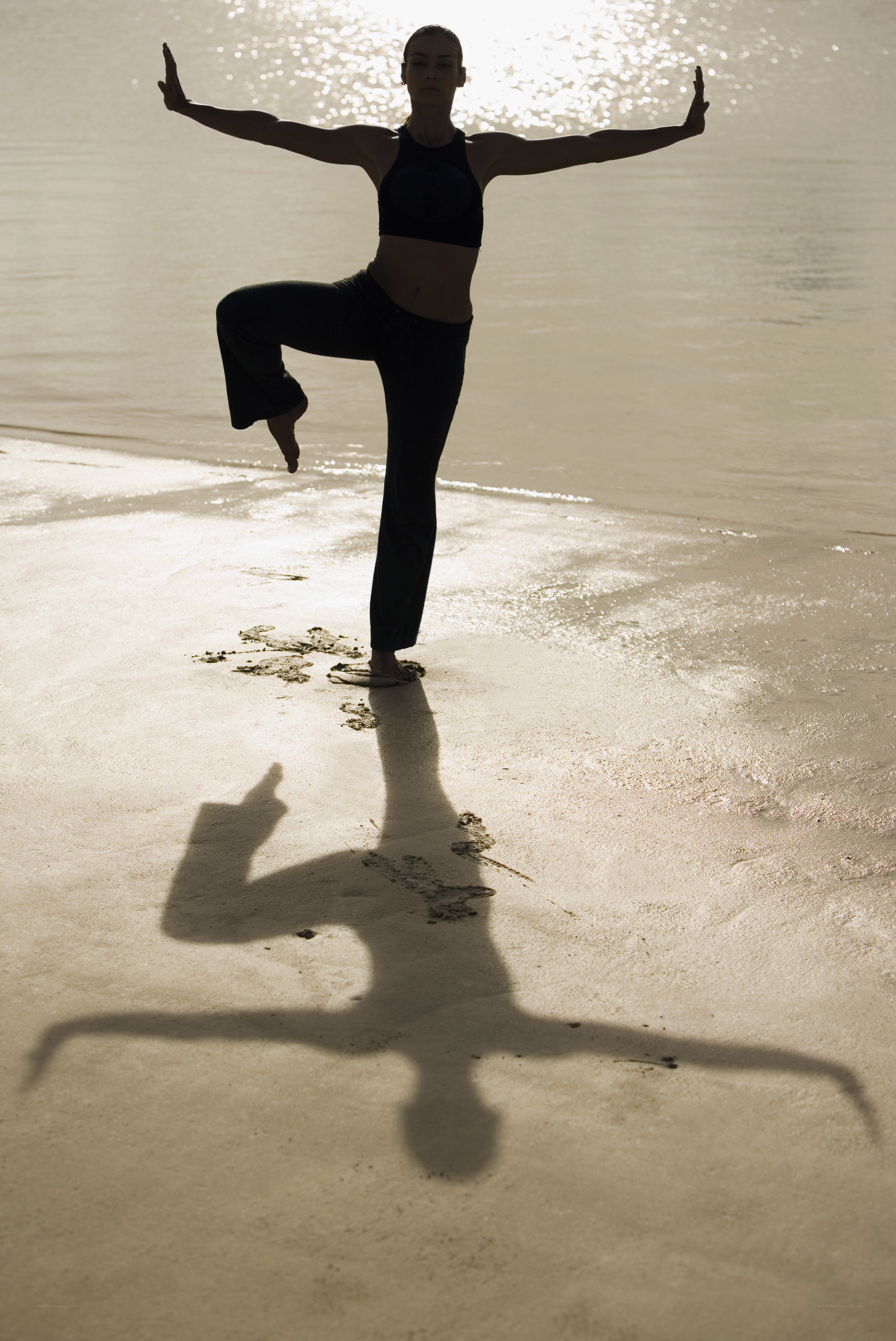 Yoga on the beach at sunset