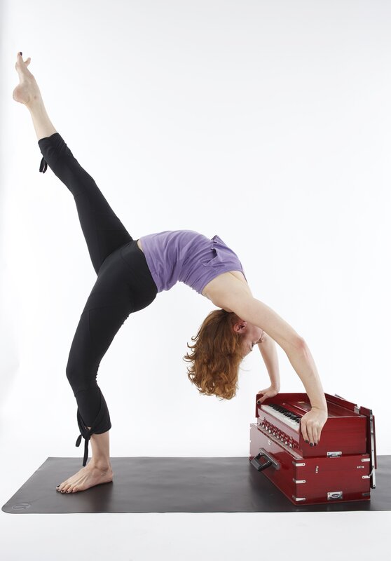 Yoga pose with harmonium