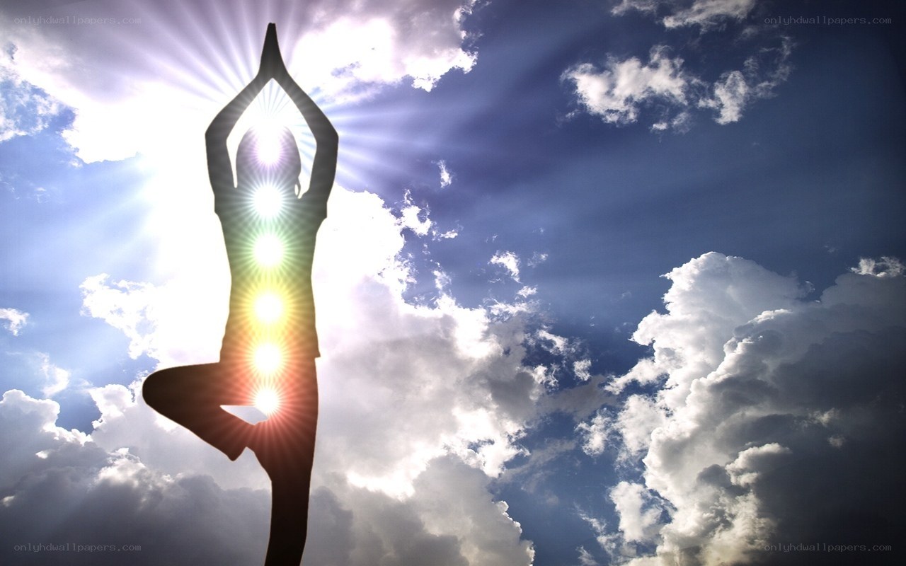 Yoga silhouette with chakras