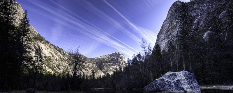 Yosemite valley with contrails