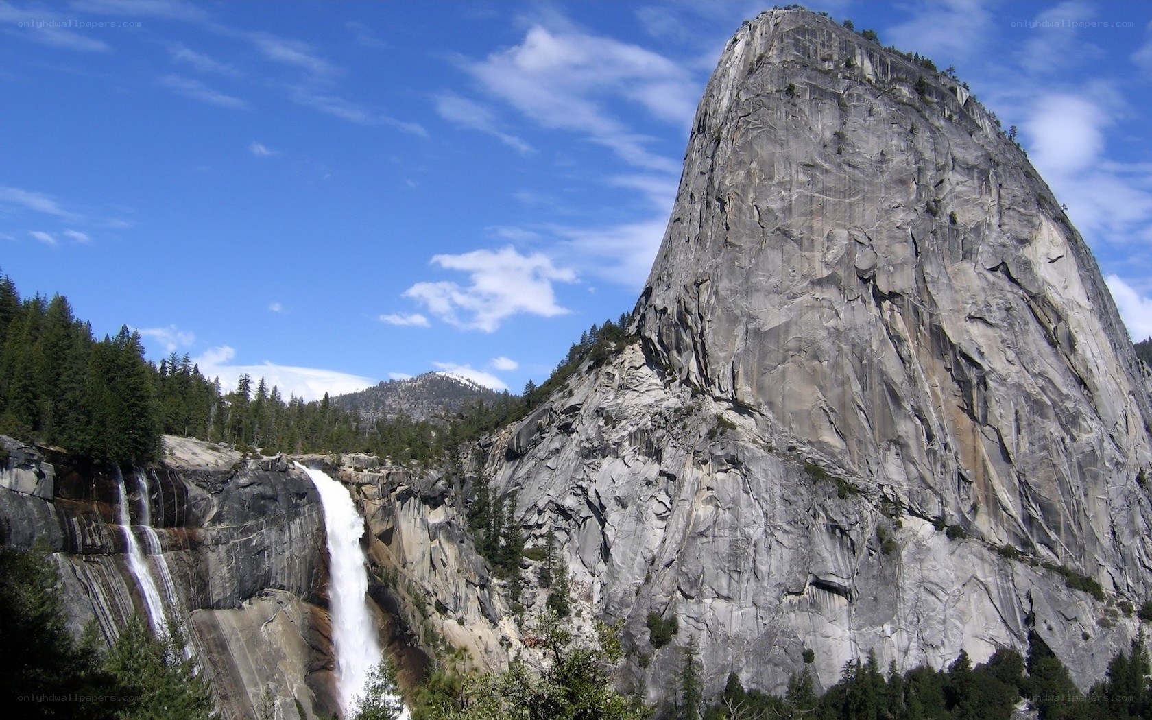 Yosemite waterfall and granite cliff
