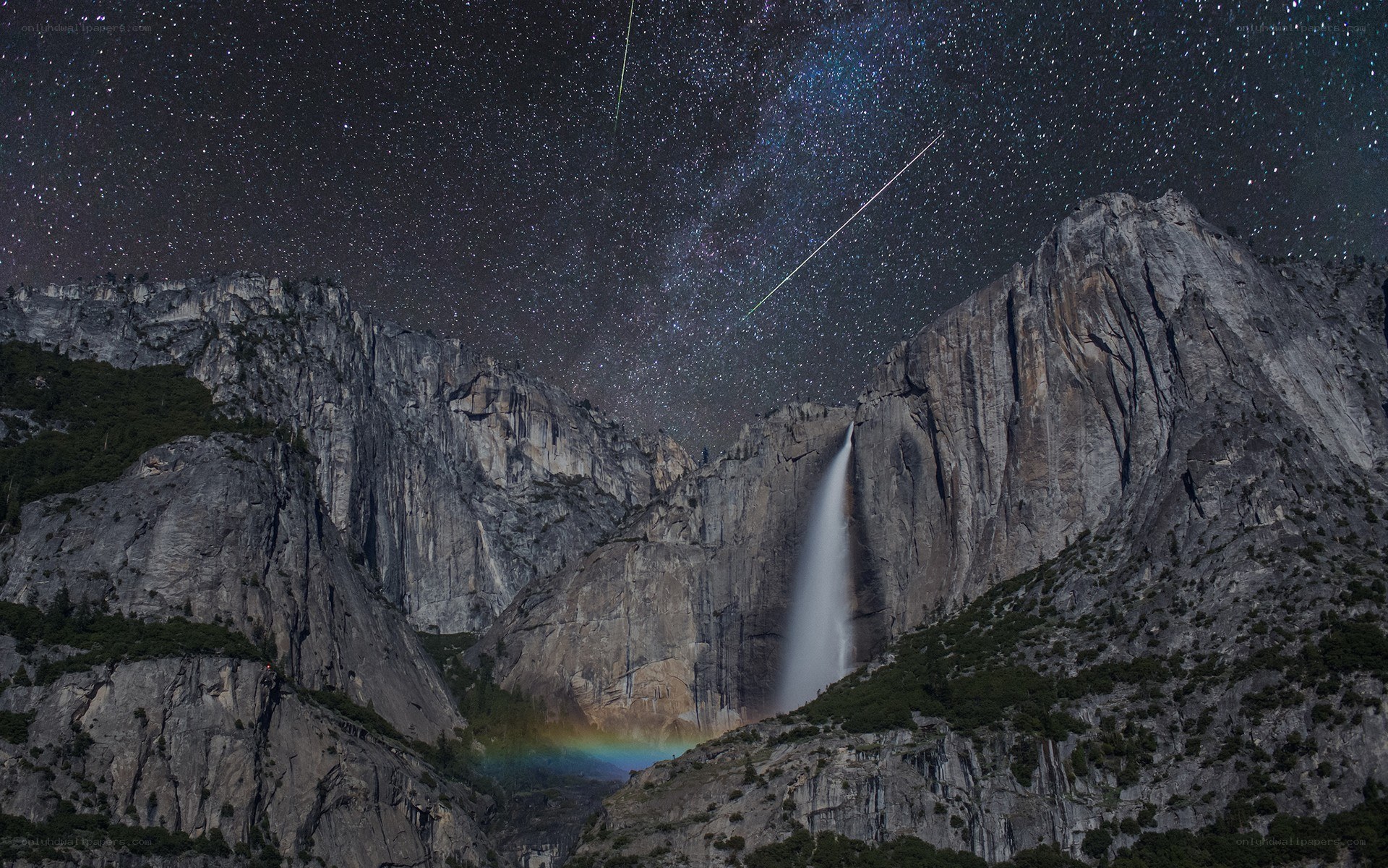 Yosemite waterfall under starry sky