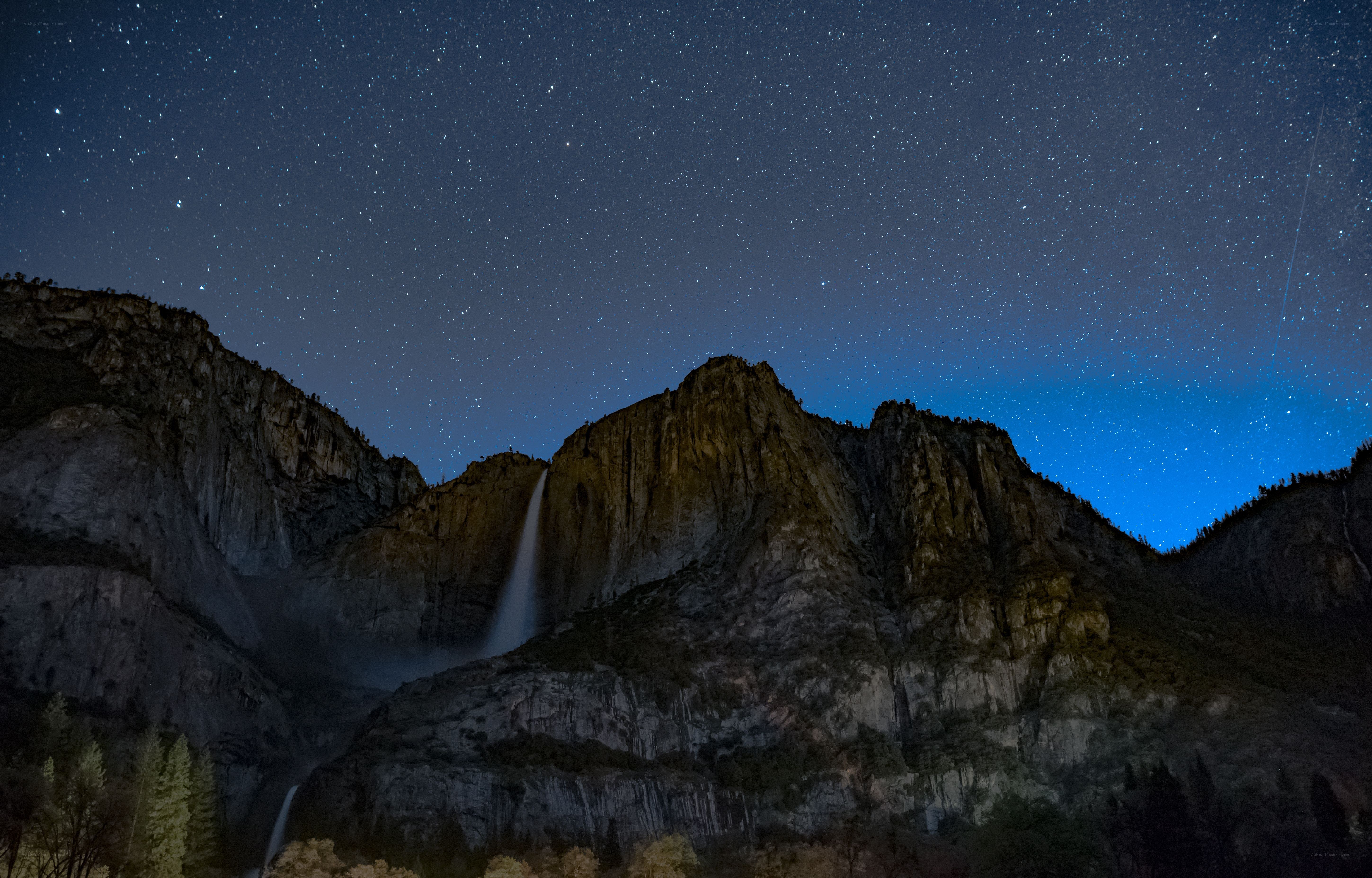 Yosemite waterfall under starry sky