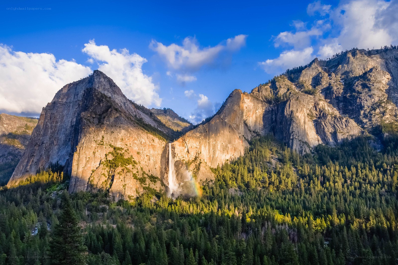 Yosemite waterfall with rainbow