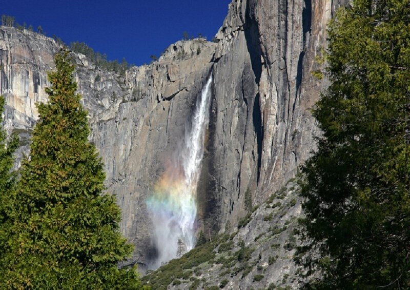 Yosemite waterfall with rainbow