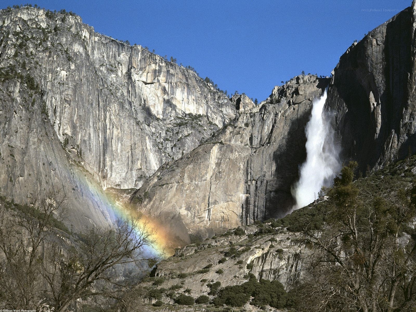 Yosemite waterfall with rainbow