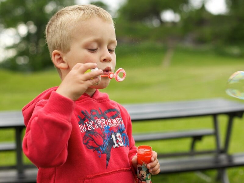 Young Boy Blowing Bubbles
