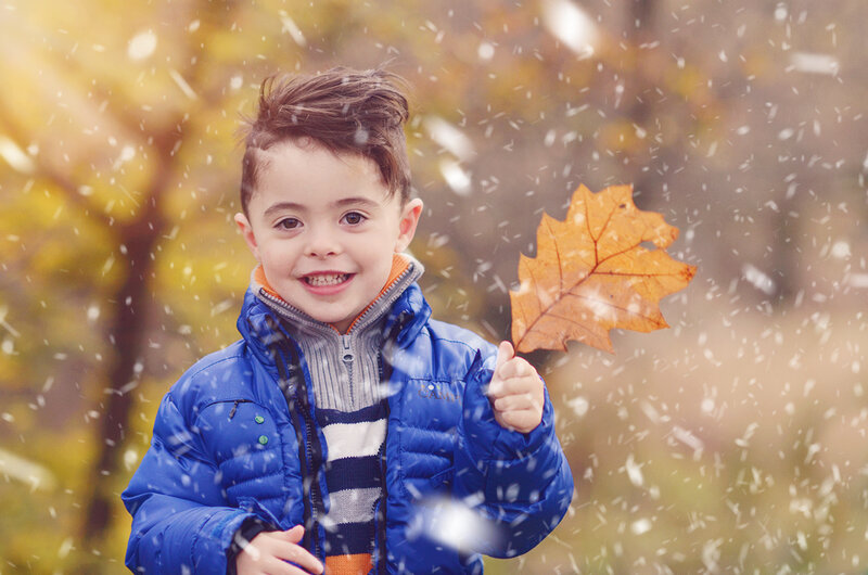 Young Boy Holding Leaf