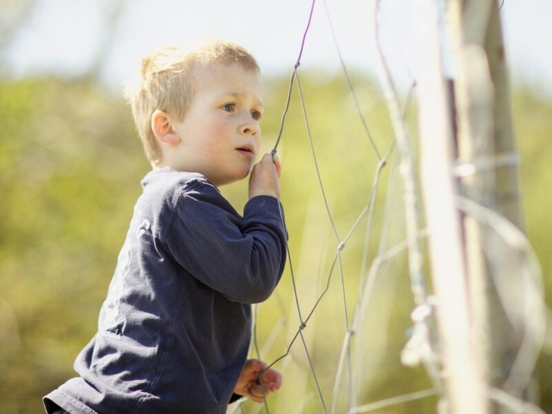 Young Boy Holding Wire