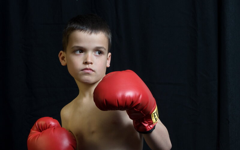 Young Boy in Boxing Gloves