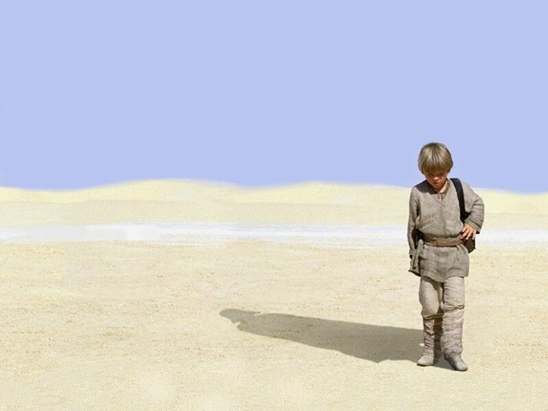 young boy in desert landscape