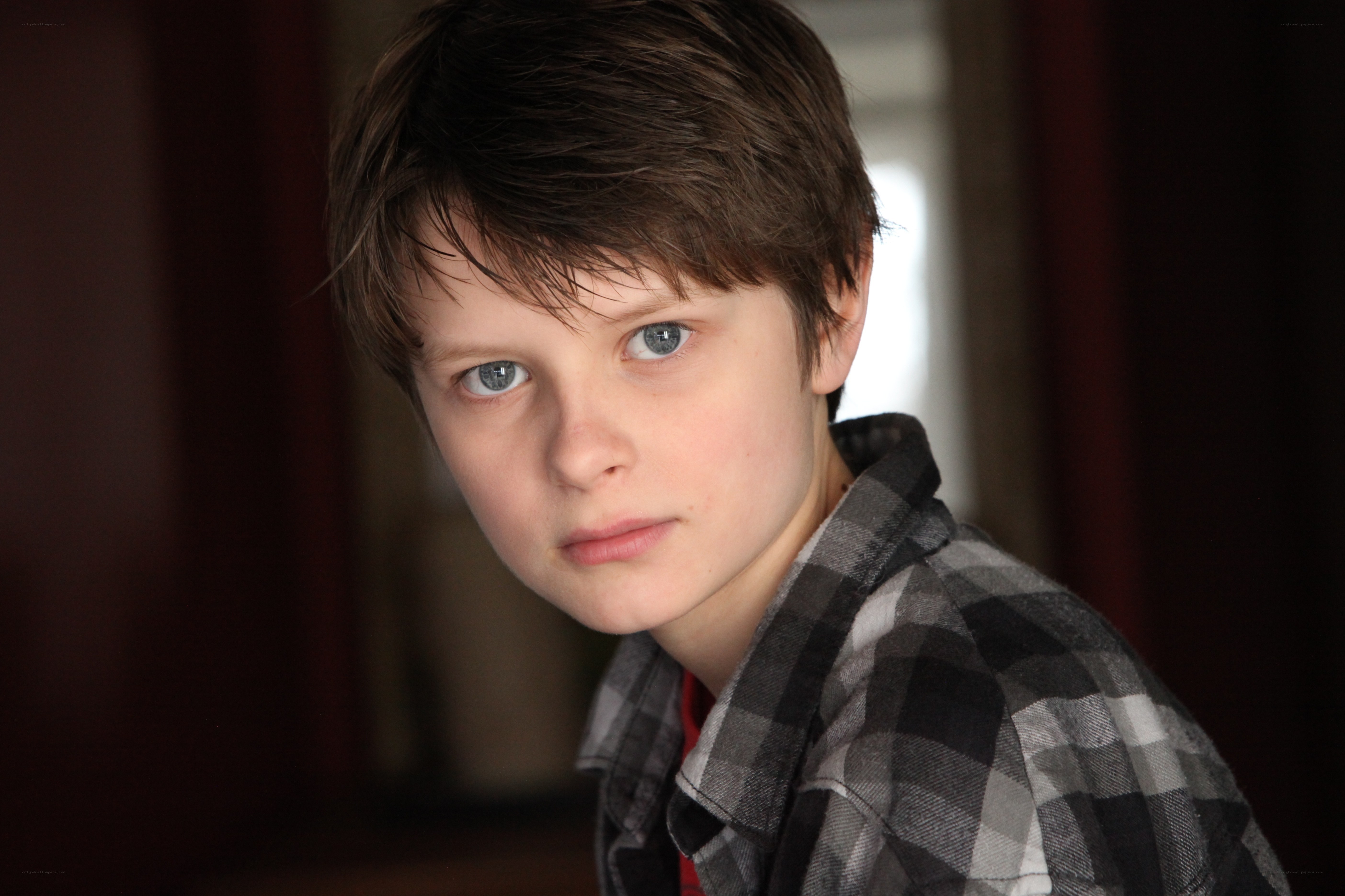 young boy in plaid shirt