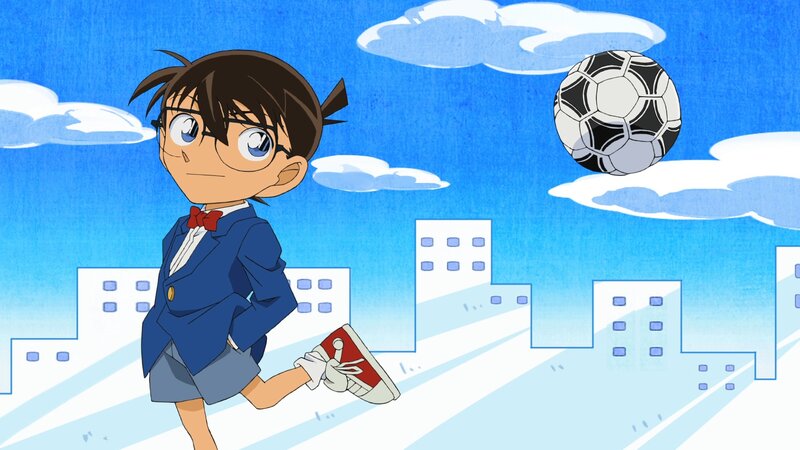 Young Boy Kicking Soccer Ball