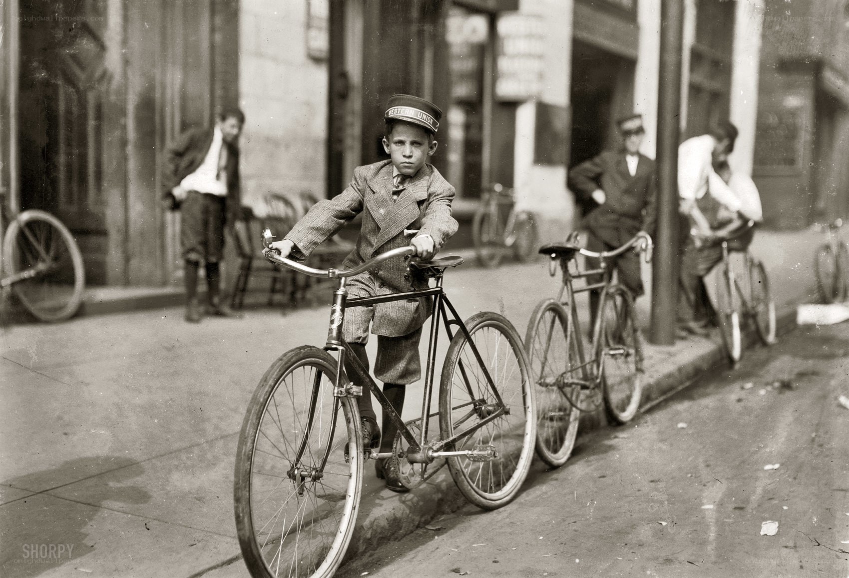Young boy on bicycle in city