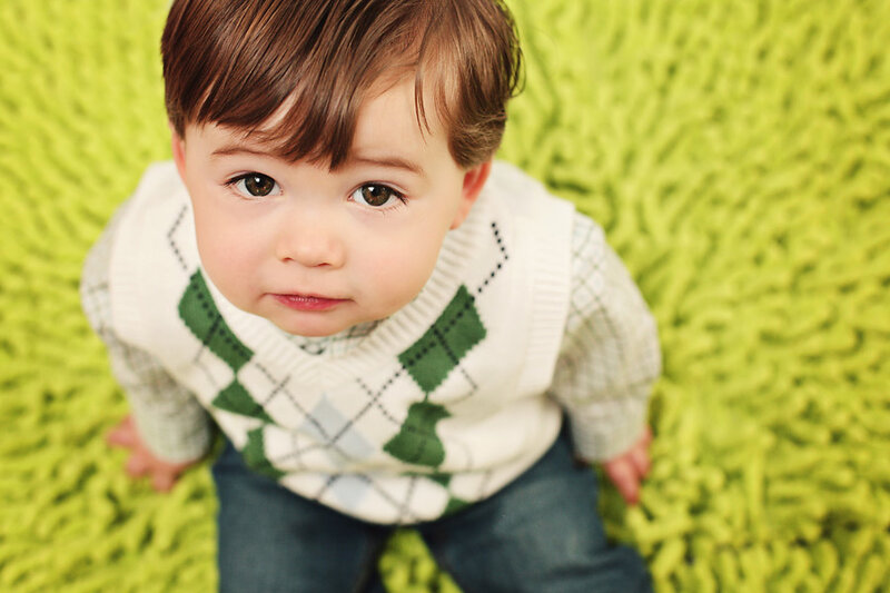 Young Boy on Green Carpet