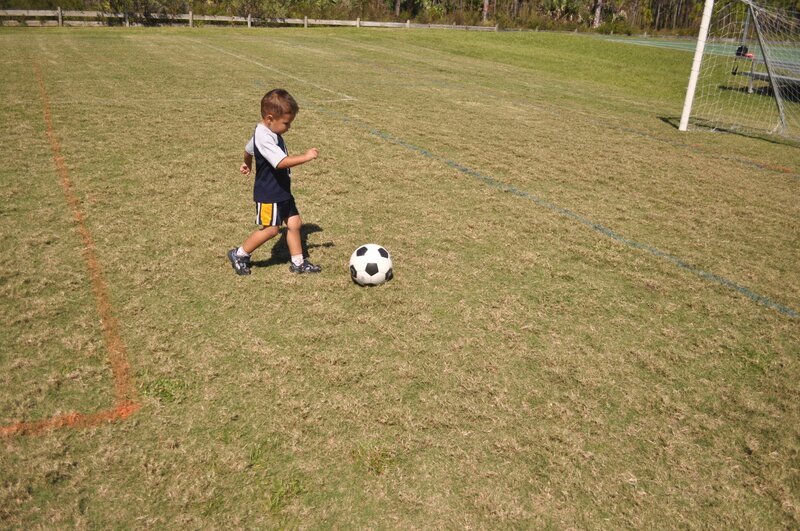 Young Boy Playing Soccer