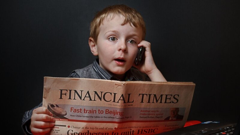 Young Boy Reading Newspaper — Black
